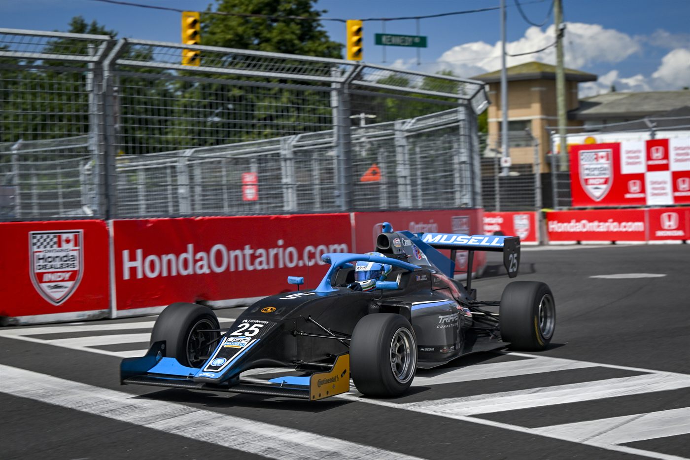 Musella's car through a corner on the Streets of Markham street circuit.